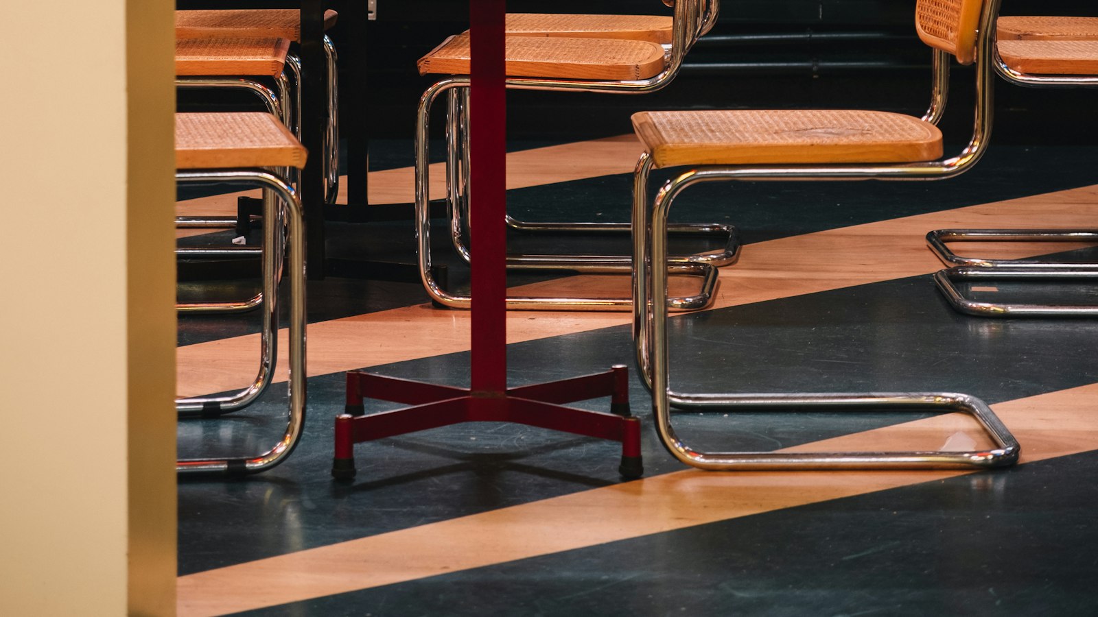 Shelves of board games behind tables in a game cafe (photo: Anthony LE / Unsplash)