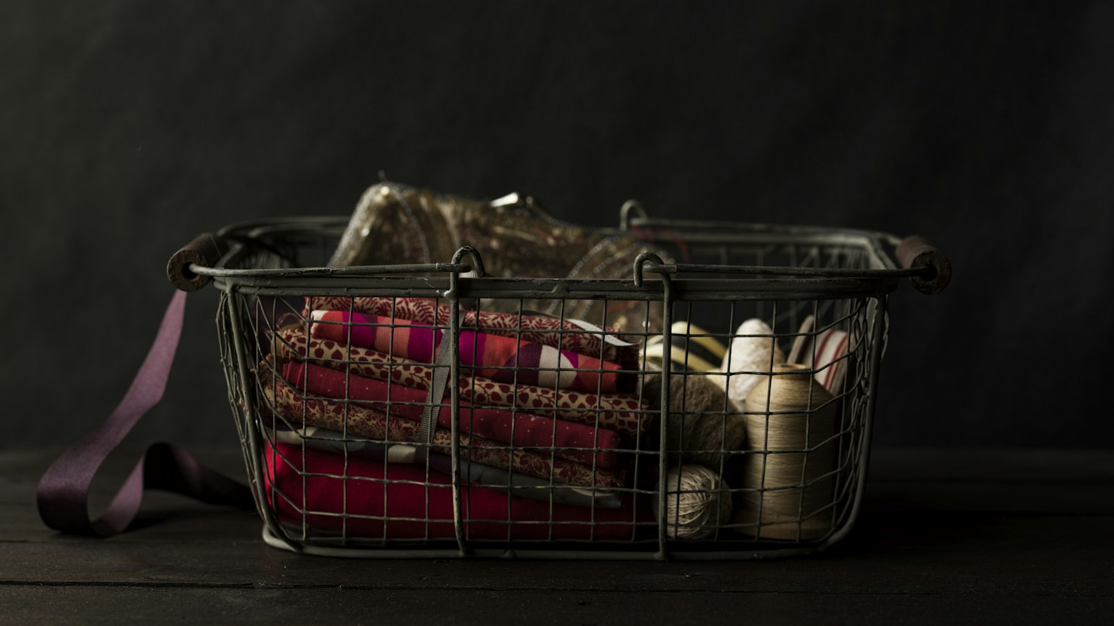 Wire shopping basket holding household items (photo: Joanna Kosinska / Unsplash)
