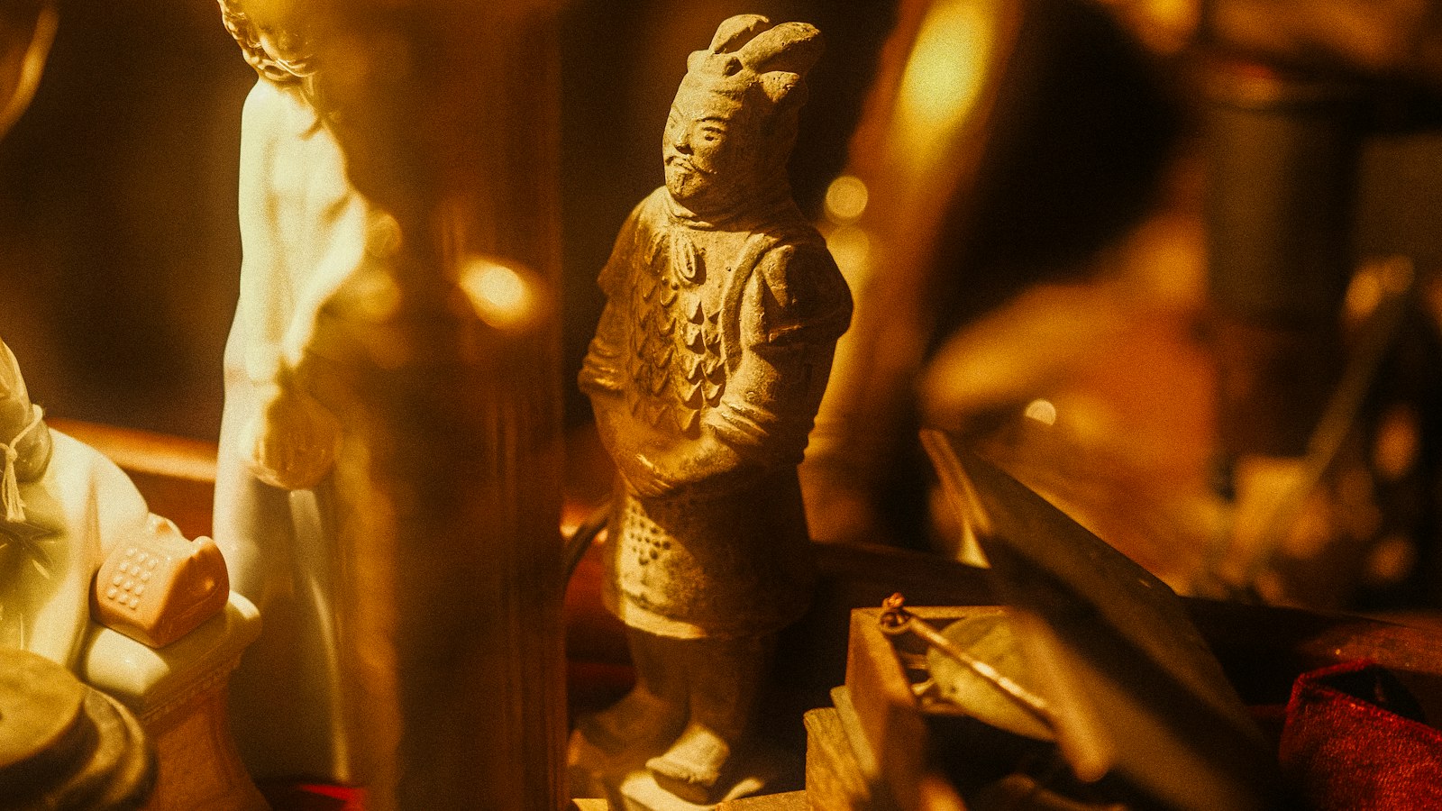 Small collectible figurines lit in warm light (photo: atelierbyvineeth / Unsplash)