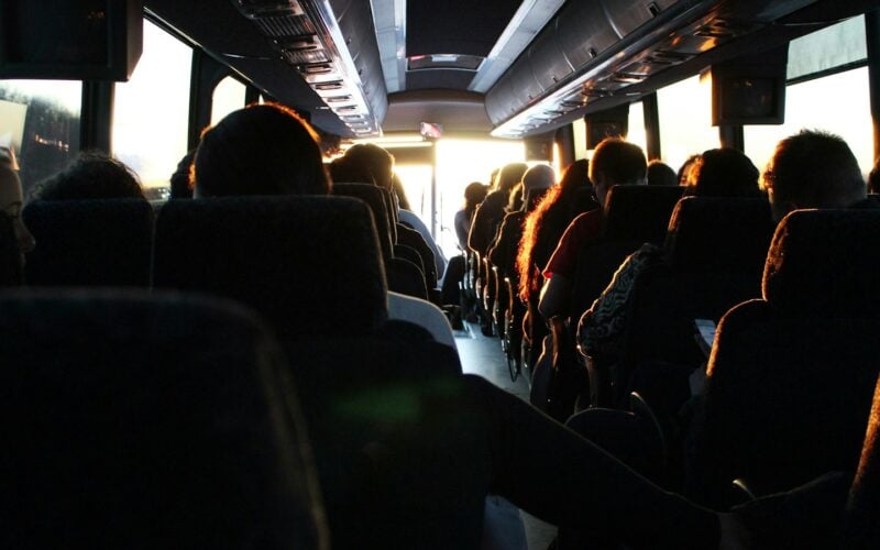 Passengers seated inside a long-distance coach (photo: Ash Gerlach / Unsplash)