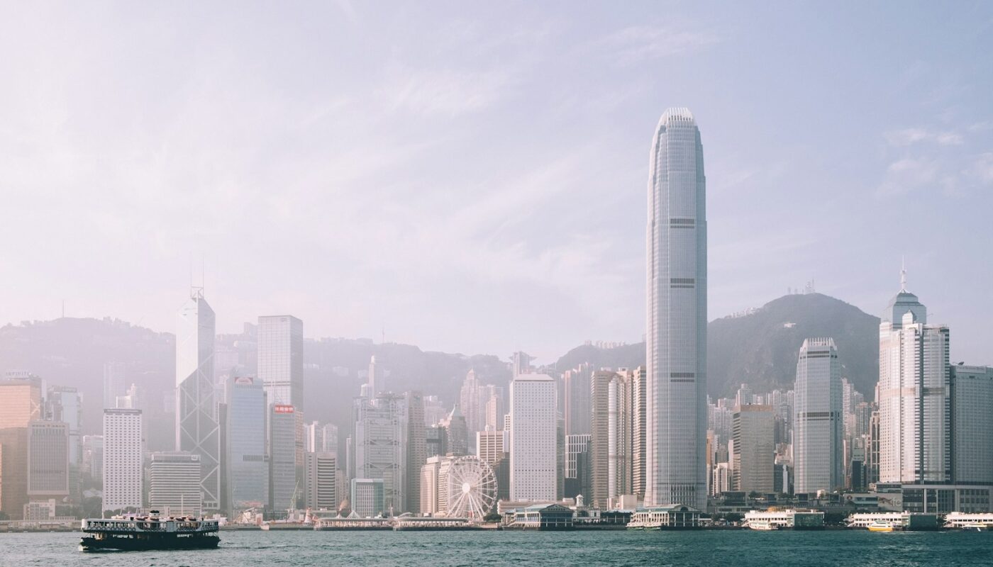 Victoria Harbour and the Hong Kong Island skyline on a hazy morning (photo: Dan Freeman / Unsplash)