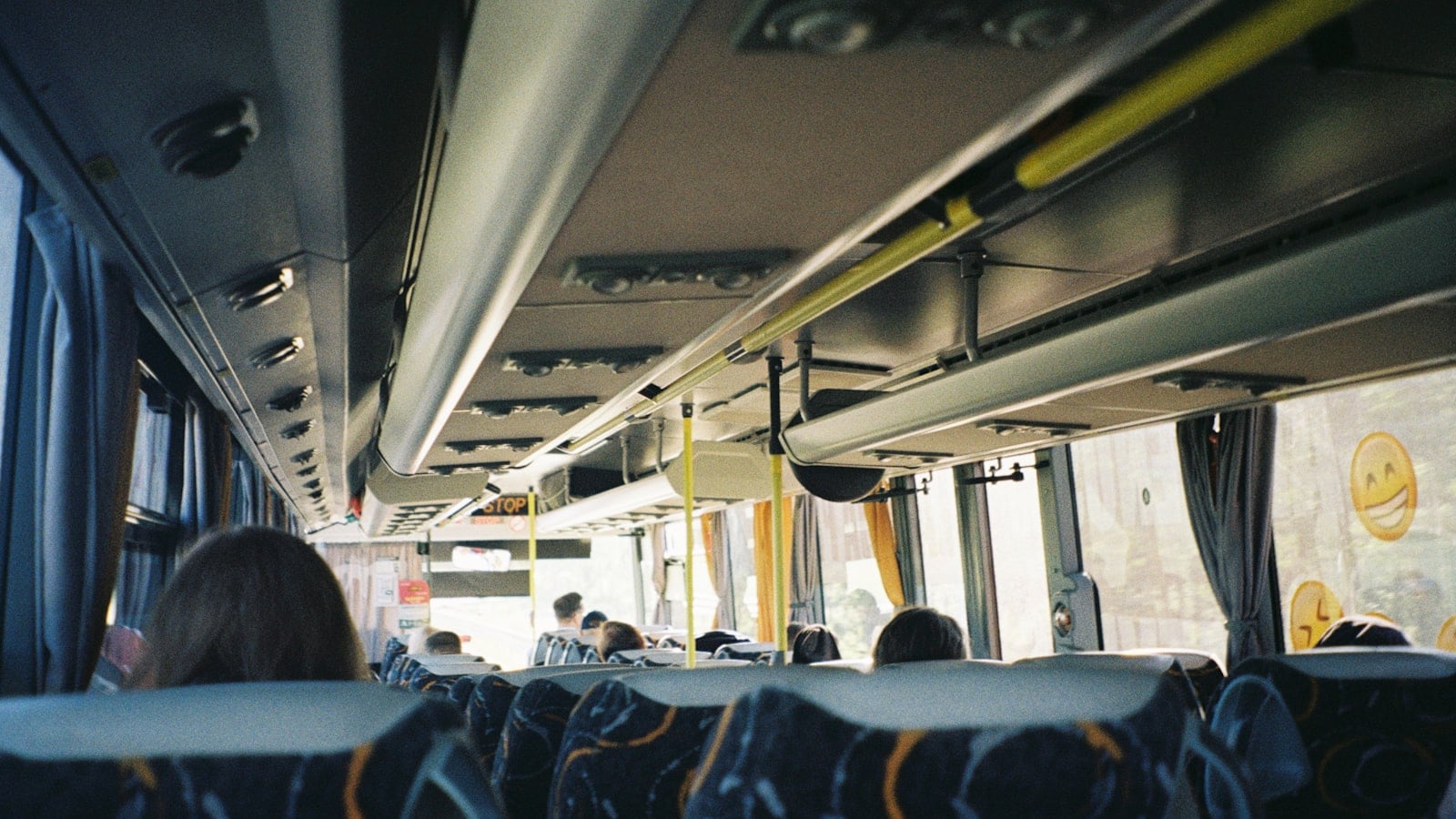 The interior aisle and seating of a long-distance coach (photo: Krisjanis Kazaks / Unsplash)
