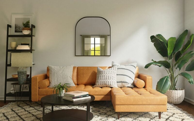 Living room with a patterned area rug under a sofa and coffee table (photo: Spacejoy / Unsplash)
