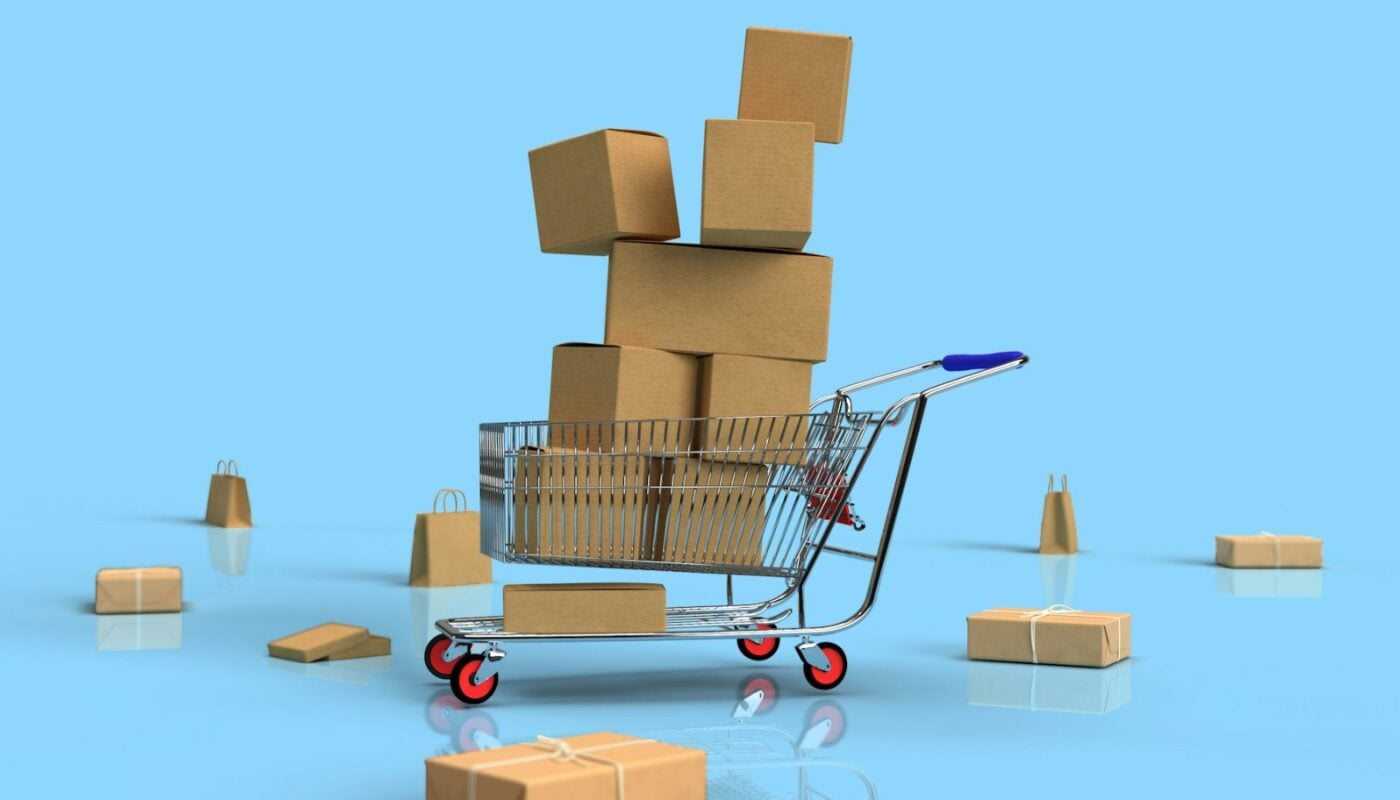 Miniature shopping trolley overflowing with cardboard parcels (photo: Shutter Speed / Unsplash)