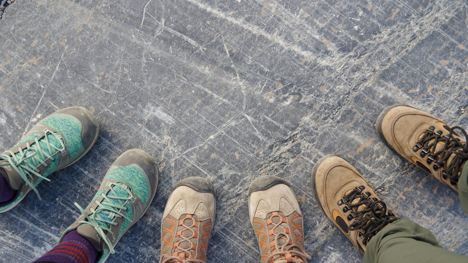 Group of hikers in different hiking boots (photo: Emma Van Sant / Unsplash)