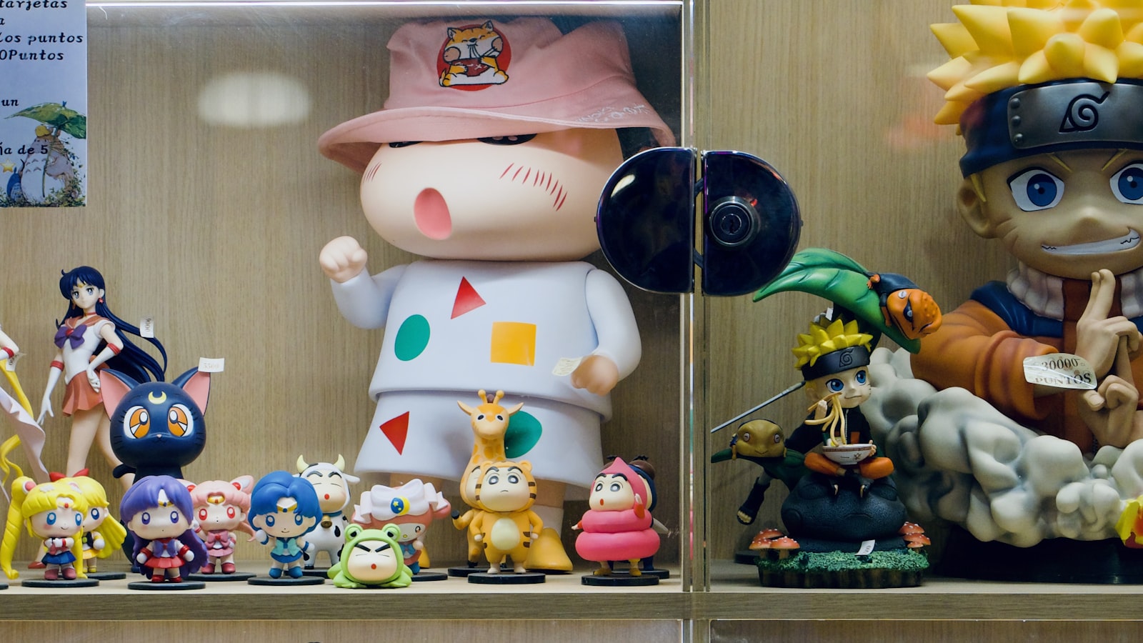 Shelves filled with collectible figures and memorabilia on display (photo: Garvit Nama / Unsplash)