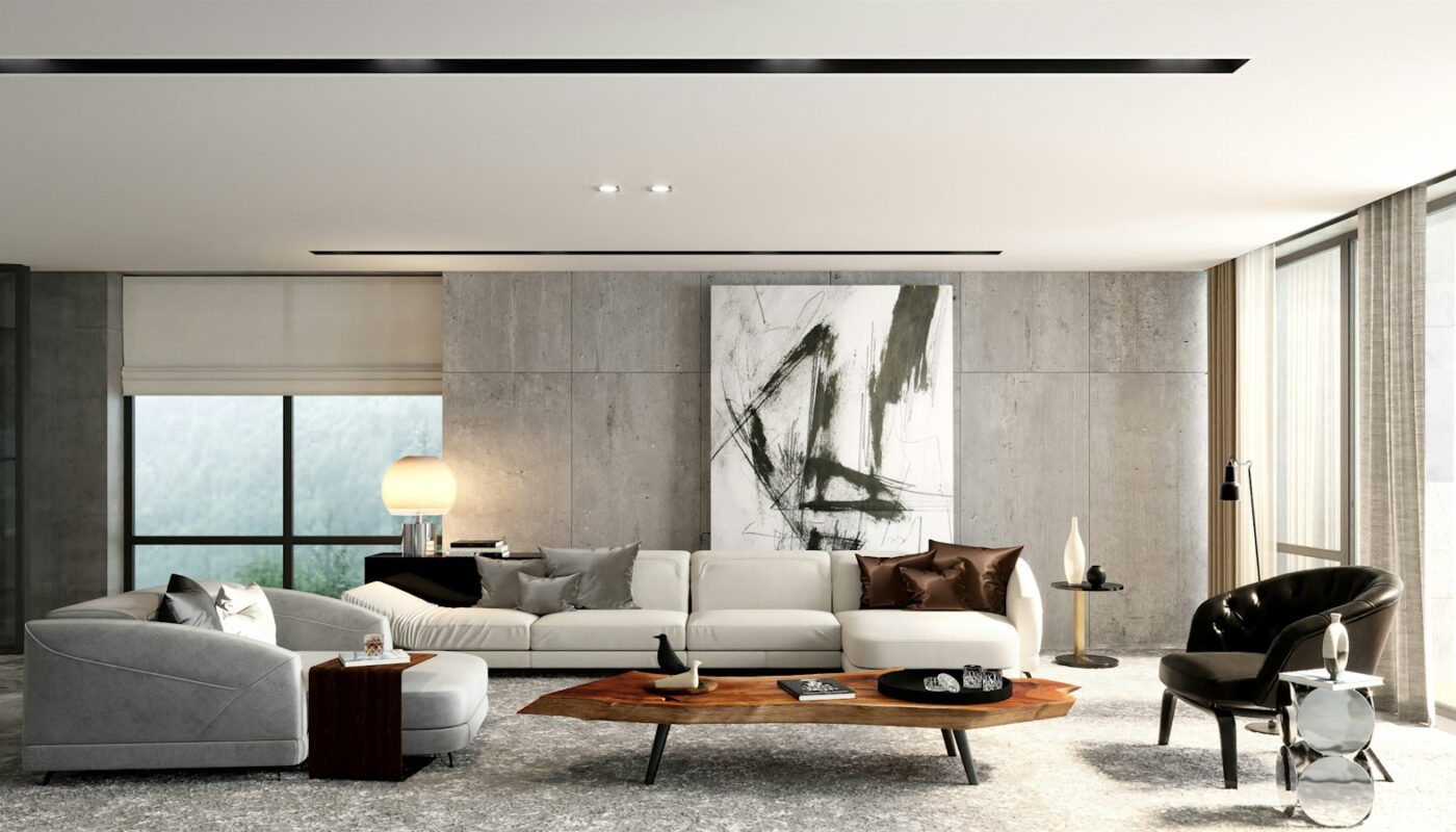 A bright modern living room with a large sectional sofa and coffee table (photo: Aalo Lens / Unsplash)